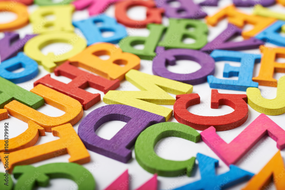 Surface covered with colorful letters Surface covered with colorful letters