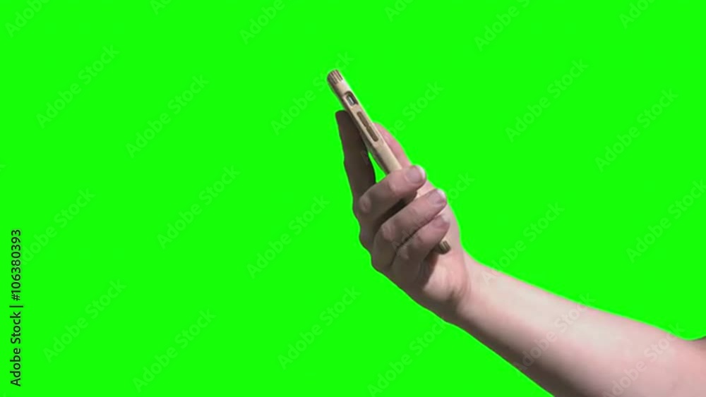 Green screen shot of hands using a smart phone with a wooden case. Pre-keyed with background replaced for easy use. Originally recorded in 4K, UHD. Green screen shot of hands using a smart phone with a wooden case. Pre-keyed with background replaced for easy use. Originally recorded in 4K, UHD.