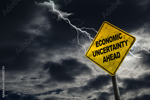 Economic Uncertainty Sign With Stormy Background and Copy Space photo