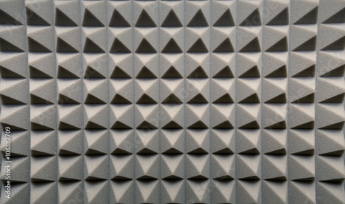 Dampening acoustical foam on recording studio wall