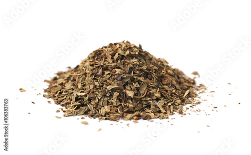 Pile of dried basil seasoning isolated