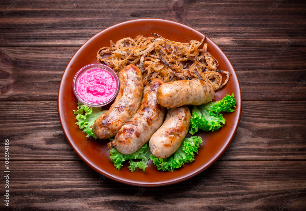 Grilled sausages with vegetables and seasoning