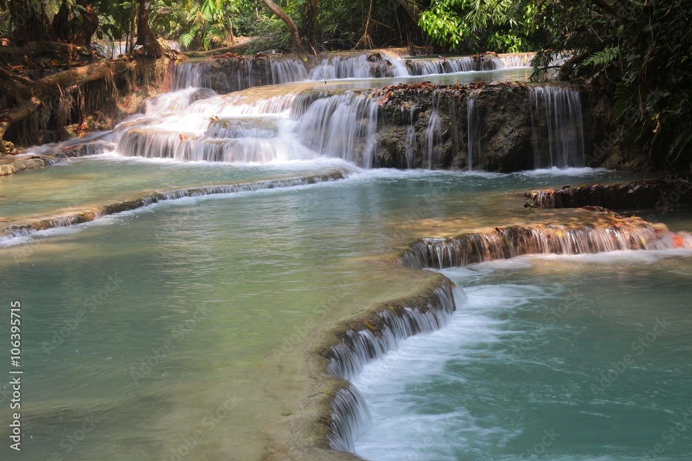 Fototapeta premium The Kuang Si Falls or known as Tat Kuang Si Waterfalls, is a three tier waterfall about 29 kilometres south of Luang Prabang ,Laos 