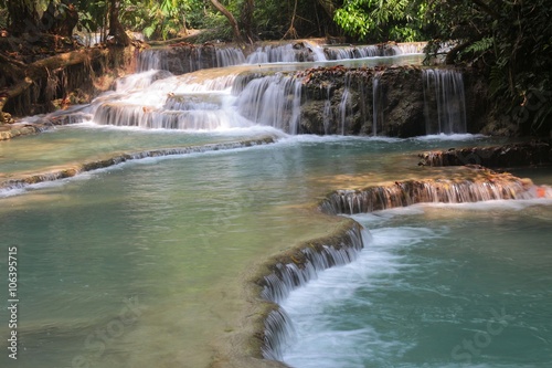  The Kuang Si Falls or known as Tat Kuang Si Waterfalls  is a three tier waterfall about 29 kilometres south of Luang Prabang  Laos 