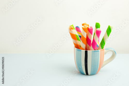 Colorful of wafer rolls in the cup