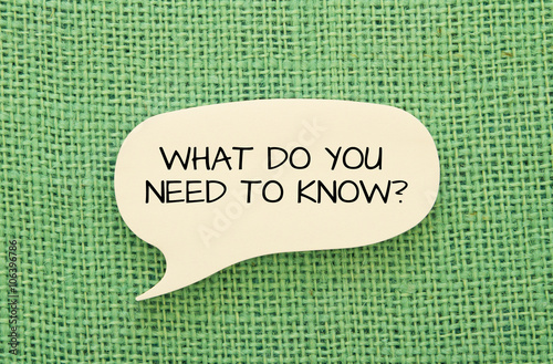 What do you need to know message on bubble speech shape sticky note on burlap