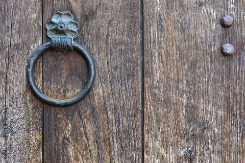The metal ring on a wooden door