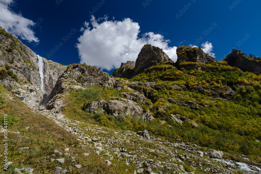 Waterfall under Ushba glacier in Mazery valleyin Georgia