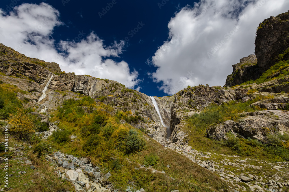 Waterfall under Ushba glacier in Mazery valleyin Georgia