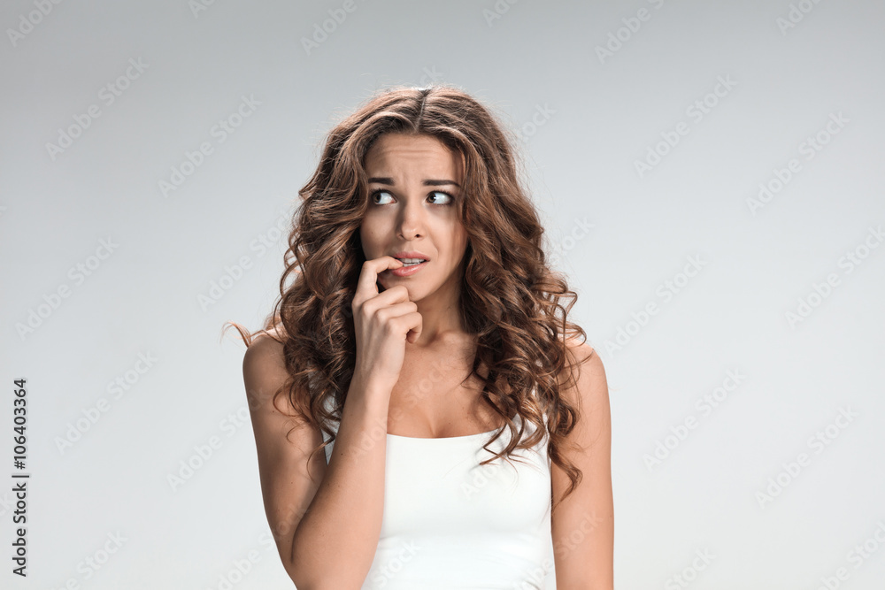 The young woman's portrait with frightened emotions The young woman's portrait with frightened emotions