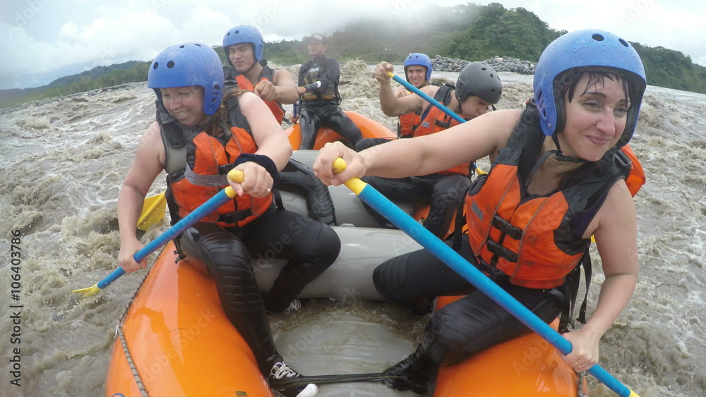 Experience the thrill of wild whitewater rafting with a group of adventurous girls in this exhilarating slow motion video.