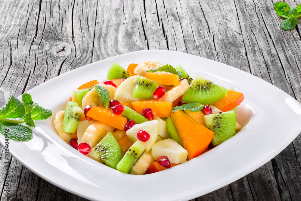 fruit salad in a wide rim square plate, close-up, top-view