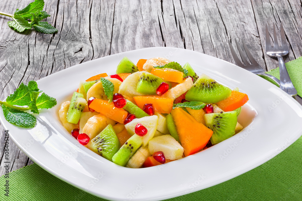 fruit salad in a wide rim square plate, close-up, top-view