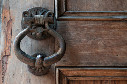 Old doorknobs, doorknockers and handles on ancient doors