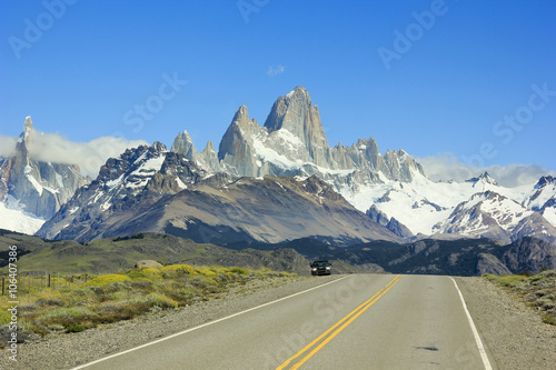 car standing on road to mountain Fitz Roy in Patagonia