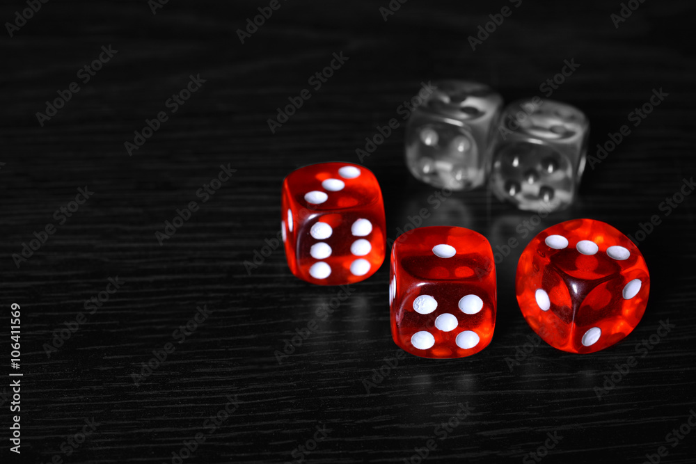 Red and Silver dice on the wooden floor Red and Silver dice on the wooden floor