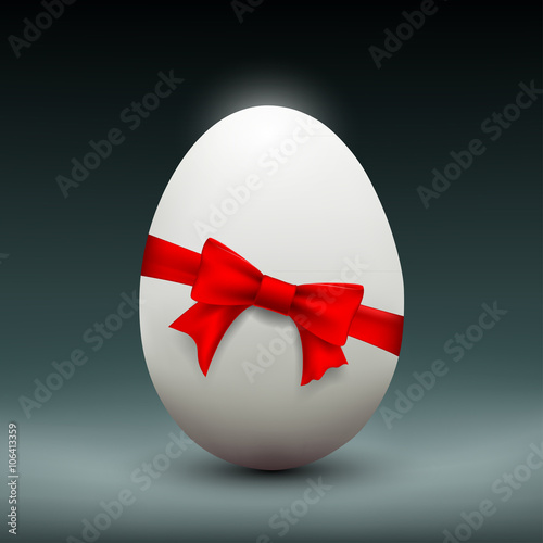 Chicken Easter egg with red ribbon