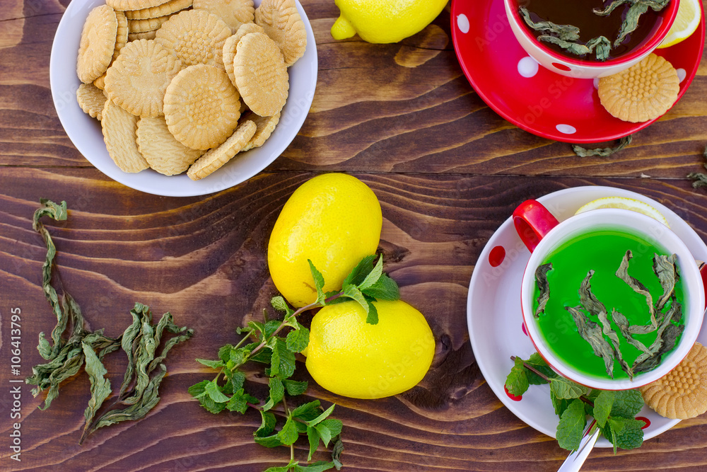 Fresh lemons, mint tea - green tea and tea cakes for pleasure