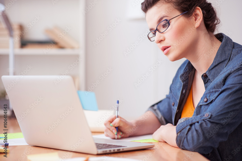 Pretty brunette girl is working with compute Pretty brunette girl is working with compute