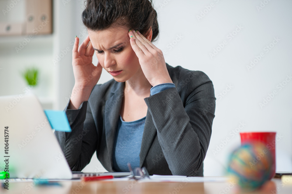 Female worker has pain in her head Female worker has pain in her head