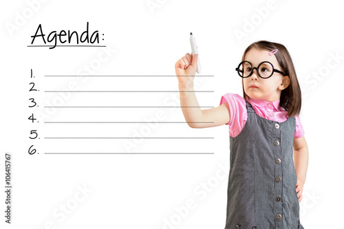 Cute little girl wearing business dress and writing blank agenda list. White background.