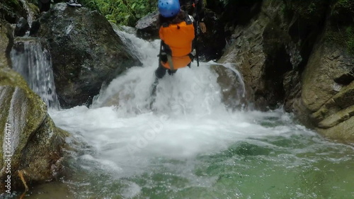 canyoning trip young femininity being dropped in falls by the journey lieder stationary camera slow motion low angle footage with sound journey joyful race sport jump courage drive water vacation veg