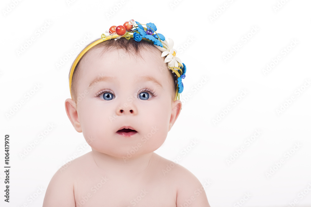 portrait of adorable little baby girl with headband with a decorative flowers. surprised baby child looking into the camera. lovely kid with big blue eyes. happy family concept portrait of adorable little baby girl with headband with a decorative flowers. surprised baby child looking into the camera. lovely kid with big blue eyes. happy family concept