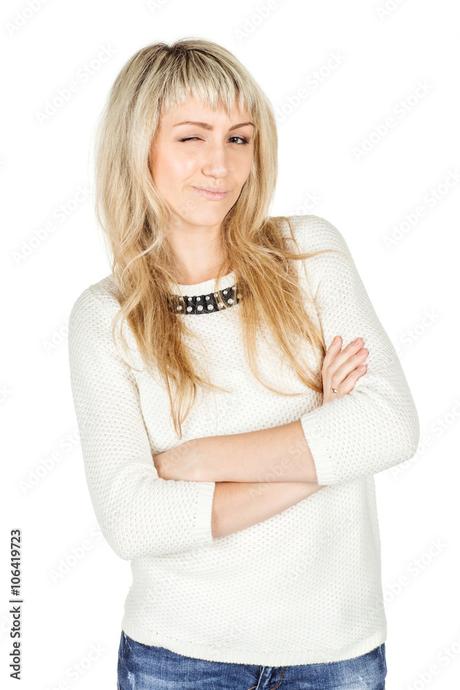Portrait of young woman winking with crossed arms. human emotion expression and lifestyle concept. image on a white studio background. Portrait of young woman winking with crossed arms. human emotion expression and lifestyle concept. image on a white studio background.