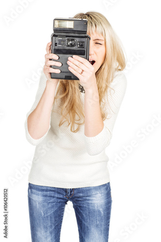 portrait of young woman taking photo with old fashioned camera. isolated on white background. vintage and lifestyle concept