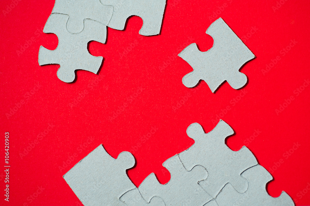 cardboard puzzles pieces on a red background cardboard puzzles pieces on a red background