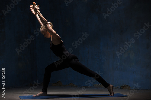 Fototapeta Naklejka Na Ścianę i Meble -  Beautiful Yoga Woman Doing Virabhadrasana 1 Pose