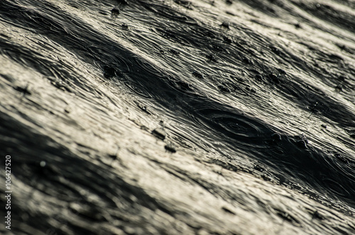 Raindrops on the dark water