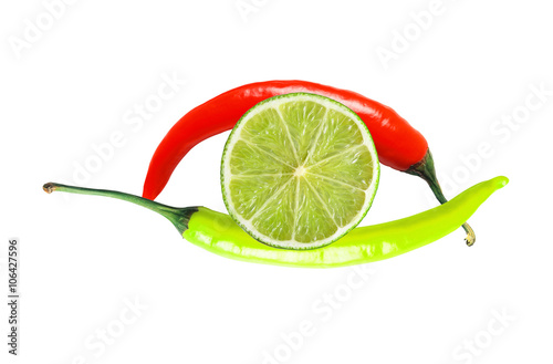 green and red hot chilly peppers and lime slice isolated on whit