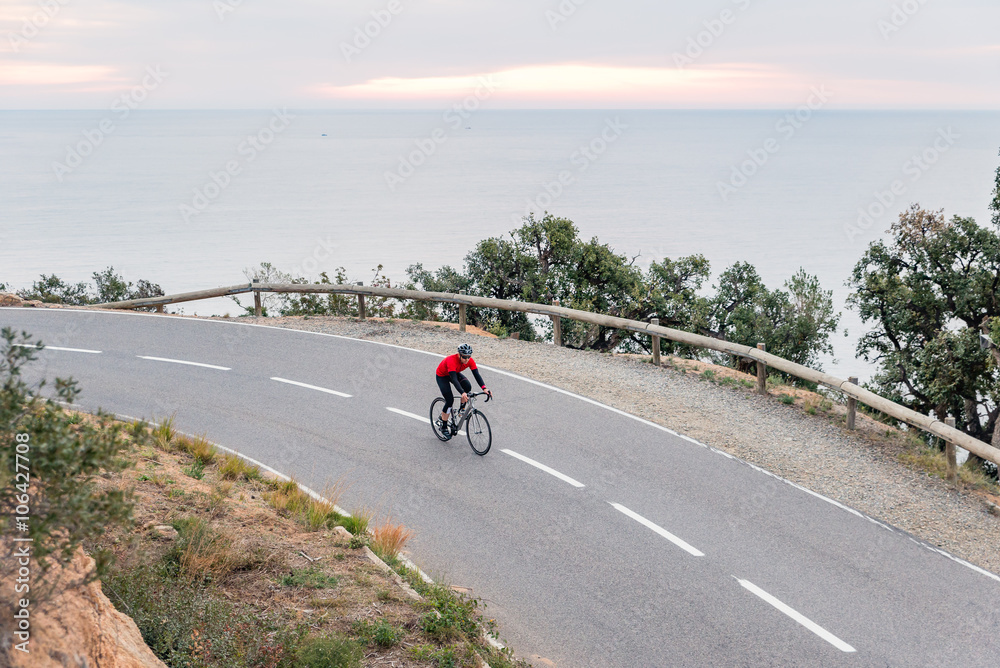 Fototapeta premium Early Morning Road Cycling along the Coastal Highway