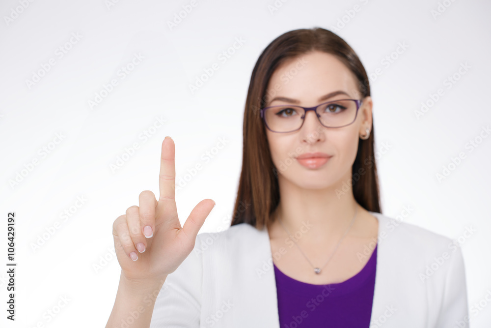 businesswoman pointing against a white background businesswoman pointing against a white background
