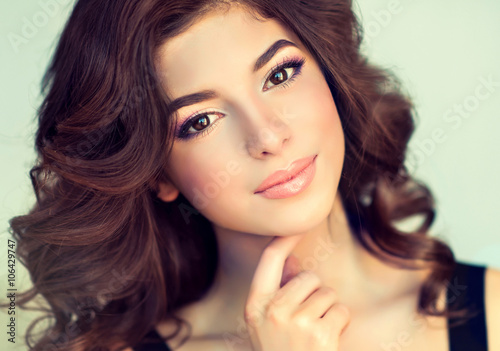 Fotografie Beautiful girl light brown hair with an elegant hairstyle , hair wave ,curly hai