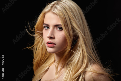 Portrait of blonde girl with fluttering hair