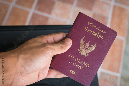 Hand holding passport 