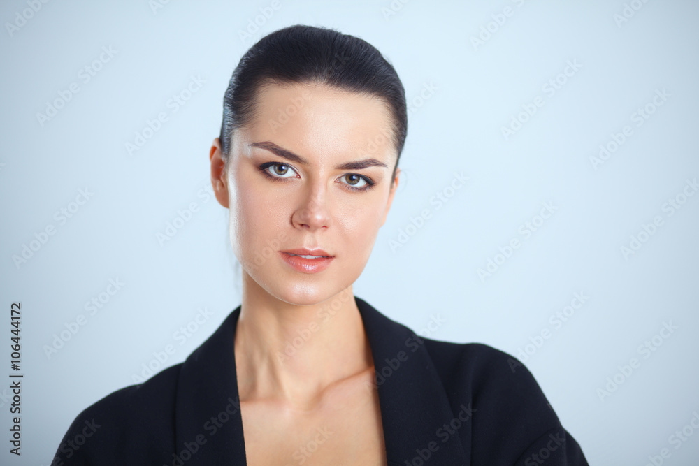 Young woman standing, isolated on gray background Young woman standing, isolated on gray background