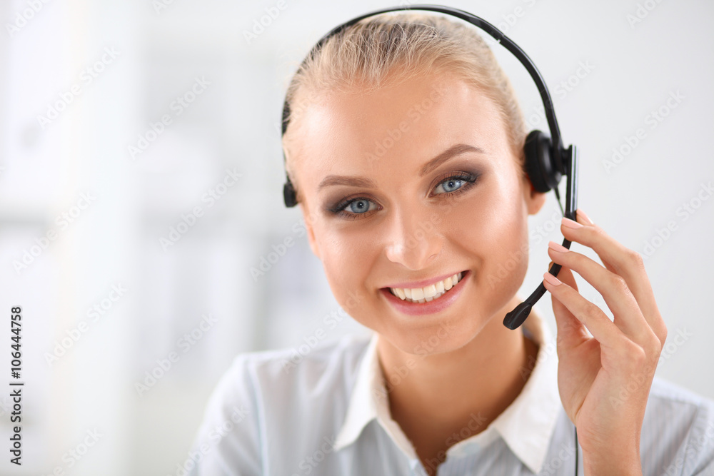 Close-up portrait of a customer service agent sitting at office Close-up portrait of a customer service agent sitting at office