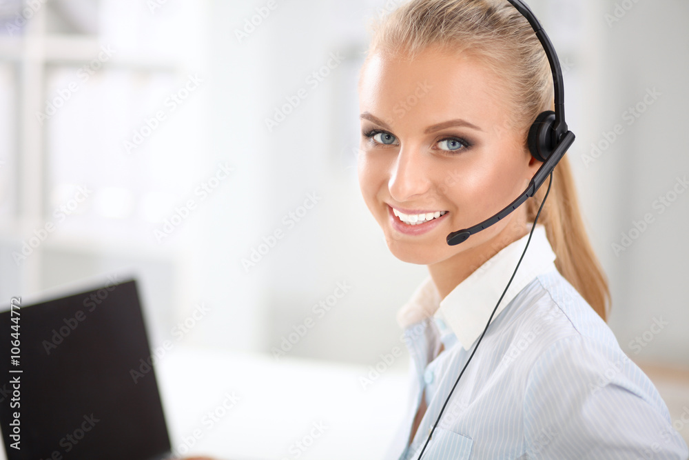 Close-up portrait of a customer service agent sitting at office Close-up portrait of a customer service agent sitting at office