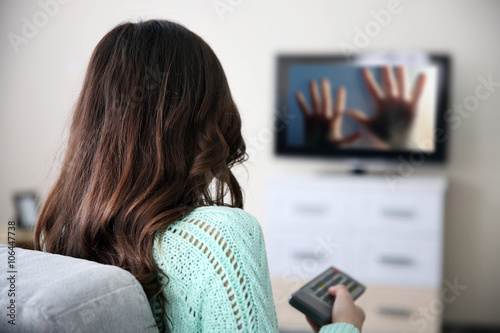 Young beautiful woman watch...