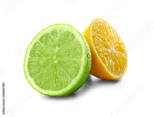 Halves of lime and lemon isolated on white