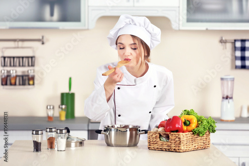 Young woman cooking in the ...
