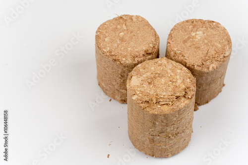 Wooden briquettes over white background