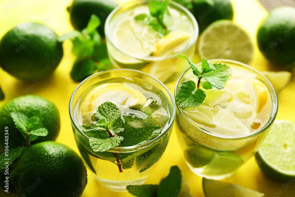 Mojito drinks with lime, lemon and mint, closeup