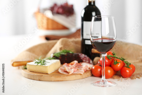 Glass of wine with food on table closeup
