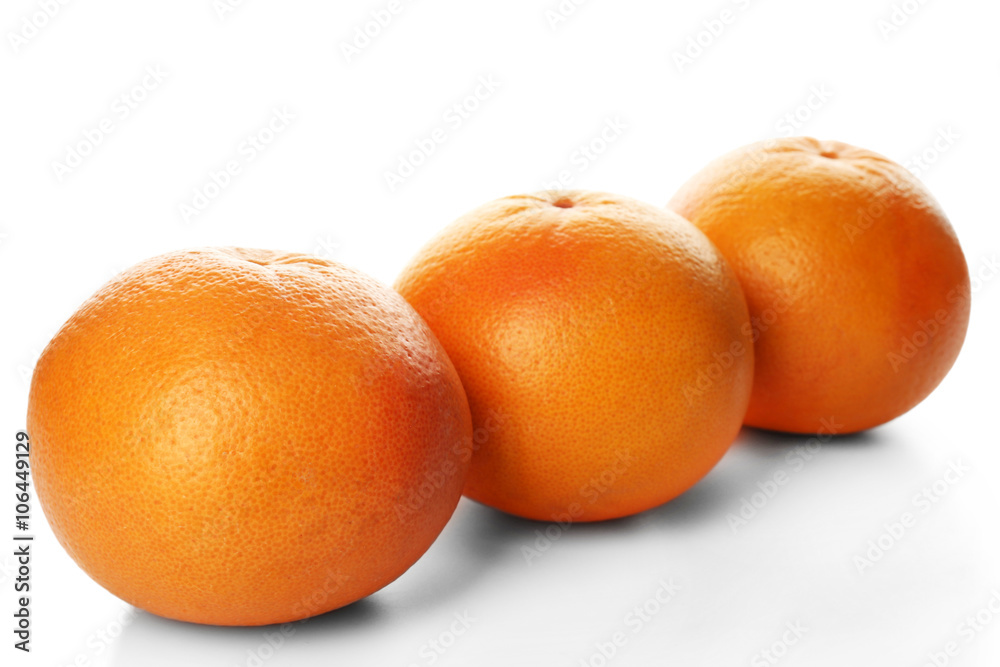 Grapefruits in a row isolated on white background Grapefruits in a row isolated on white background