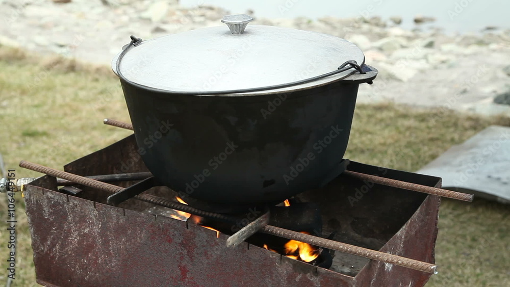 The cast-iron pot is on fire. Russian holiday Maslenitsa