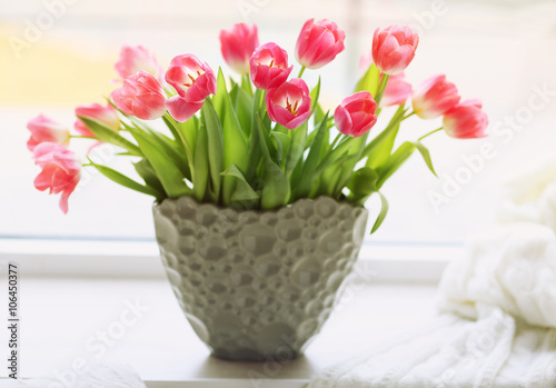 Fototapeta Naklejka Na Ścianę i Meble -  Fresh bouquet of tulips on a windowsill